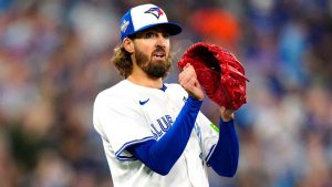 Toronto Blue Jays pitcher Kevin Gausman (34) celebrates a catch by Toronto Blue Jays first baseman Vladimir Guerrero Jr. (not shown) to end the top of the sixth inning of Game 2 World Series playoff MLB baseball action against the Los Angeles Dodgers in Toronto on Saturday, Oct. 25, 2025. (Frank Gunn/CP)