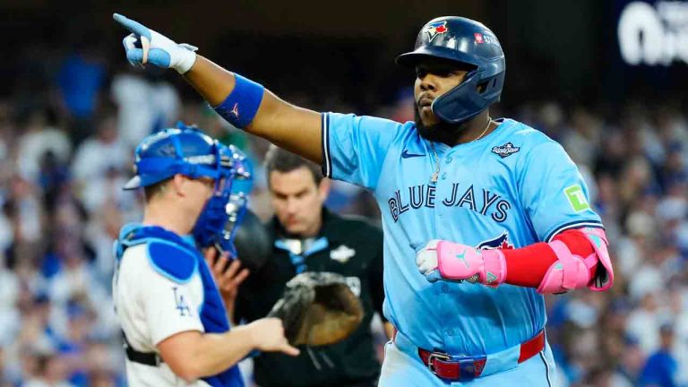 Toronto Blue Jays' Vladimir Guerrero Jr. (27) celebrates his two-run home run against the Los Angeles Dodgers during third inning Game 4 World Series playoff MLB baseball action in Los Angeles on Tuesday, Oct. 28, 2025. (Frank Gunn/CP)