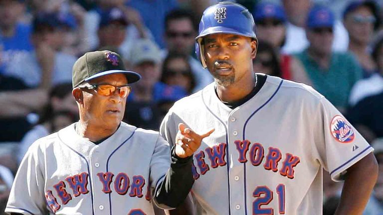 New York Mets third base coach Sandy Alomar Sr., left, talks to Carlos Delgado at third base during the ninth inning of a baseball game against the Chicago Cubs, Friday, Aug. 3, 2007, in Chicago. The Mets won, 6-2. (Nam Y. Huh/AP)
