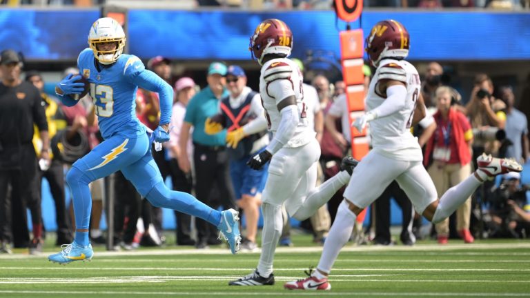 Los Angeles Chargers wide receiver Keenan Allen (13) runs after a catch during the first half of an NFL football game against the Washington Commanders, Sunday, Oct. 5, 2025, in Inglewood, Calif. (AP Photo/Carrie Giordano )