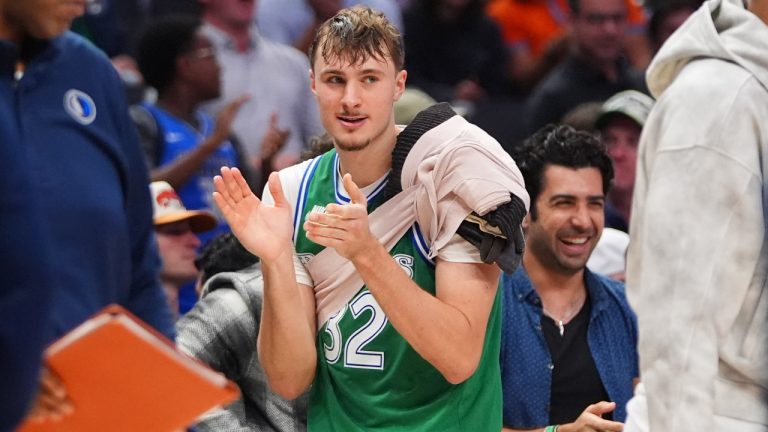 Dallas Mavericks forward Cooper Flagg looks on from the sidelines during the second half of an NBA basketball game against the Oklahoma City Thunder in Dallas, Monday, Oct. 27, 2025. (LM Otero/AP)