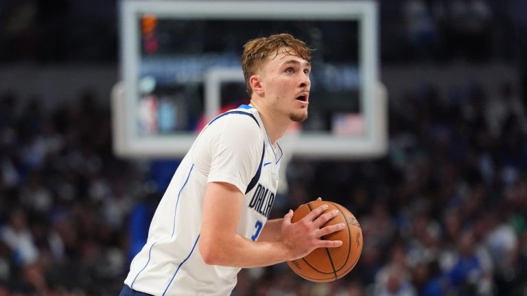 Dallas Mavericks forward Cooper Flagg moves the ball during the second half of an NBA basketball game against the San Antonio Spurs in Dallas, Wednesday, Oct. 22, 2025. (AP Photo/LM Otero)