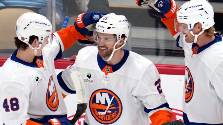 New York Islanders' Jonathan Drouin celebrates after his goal with Matthew Schaefer and Scott Mayfield during the first period of an NHL game against the Pittsburgh Penguins in Pittsburgh, Thursday, Oct. 9, 2025. (AP/Gene J. Puskar)
