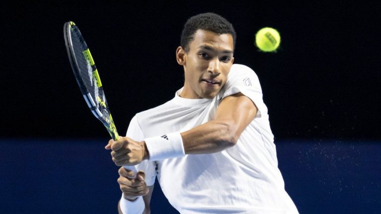 Canada's Felix Auger-Aliassime returns the ball to Canada's Gabriel Diallo during their first round match at the Swiss Indoors tennis tournament at the St. Jakobshalle in Basel, Switzerland, Wednesday, Oct. 22, 2025. (Georgios Kefalas/Keystone via AP)