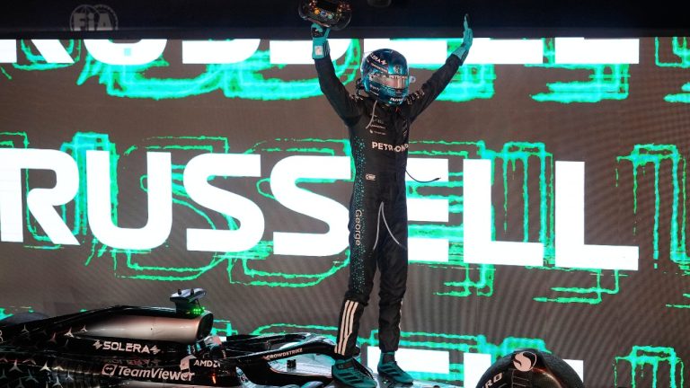 Mercedes driver George Russell of Britain celebrates after winning the Singapore Formula One Grand Prix at the Marina Bay Street Circuit in Singapore, Sunday, Oct. 5, 2025. (AP Photo/Vincent Thian)