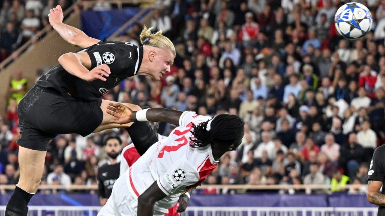 Manchester City's Erling Haaland, top, scores his side's second goal during the Champions League opening phase soccer match between Monaco and Manchester City at the Louis II stadium in Monaco, Wednesday, Oct. 1, 2025. (Philippe Magoni/AP)
