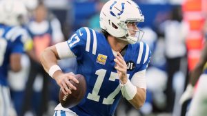 Indianapolis Colts' Daniel Jones scrambles during the second half of an NFL football game against the Arizona Cardinals Sunday, Oct. 12, 2025, in Indianapolis. (AP Photo/AJ Mast)