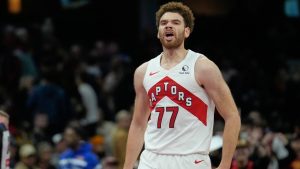 Toronto Raptors' Jamison Battle (77) reacts after hitting a three-point basket in the second half of an an NBA Cup basketball game against the Cleveland Cavaliers in Cleveland, Friday, Oct. 31, 2025. (AP Photo/Sue Ogrocki)