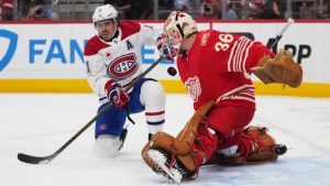 Detroit Red Wings goalie John Gibson stops a shot by Montreal Canadiens right winger Brendan Gallagher in the first period of an NHL game Thursday, Oct. 9, 2025, in Detroit. (Paul Sancya/AP)