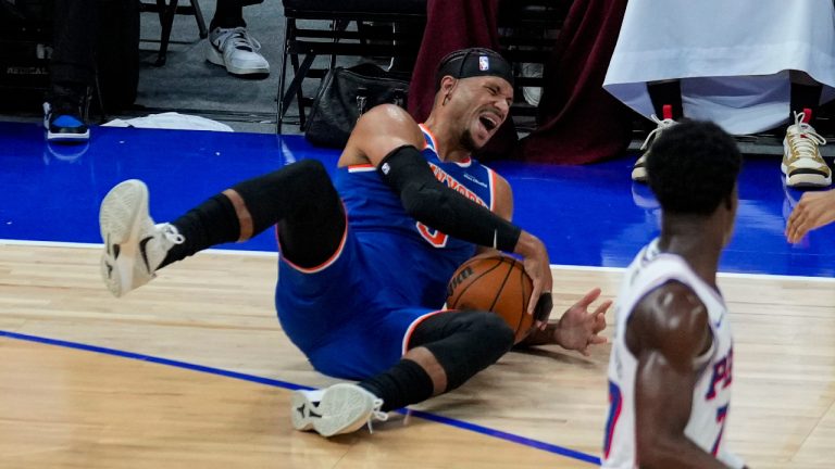 New York Knicks' Josh Hart reacts as he falls during the first half of an NBA preseason basketball game against the Philadelphia 76ers, Thursday, Oct. 2, 2025, in Abu Dhabi, United Arab Emirates. (Altaf Qadri/AP)