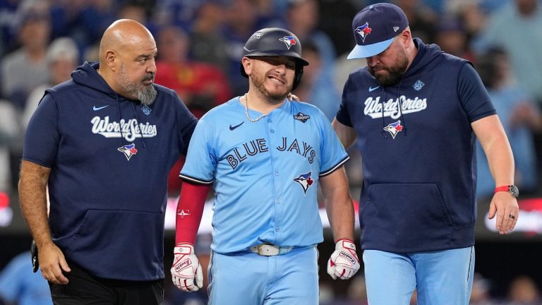 Toronto Blue Jays' Alejandro Kirk leaves game after getting hit by a pitch against the Los Angeles Dodgers during the ninth inning in Game 6 of baseball's World Series, Friday, Oct. 31, 2025, in Toronto. (Brynn Anderson/AP)