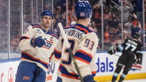 Edmonton Oilers' Connor McDavid (97) and Ryan Nugent-Hopkins (93) celebrate a goal against the Utah Mammoth during second period NHL action, in Edmonton on Tuesday, October 28, 2025. (Jason Franson/CP)
