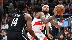 Toronto Raptors' Brandon Ingram (3) works around Brooklyn Nets' Terance Mann (14) during first half NBA preseason basketball action in Toronto on Friday, Oct. 17, 2025. THE CANADIAN PRESS/Jon Blacker