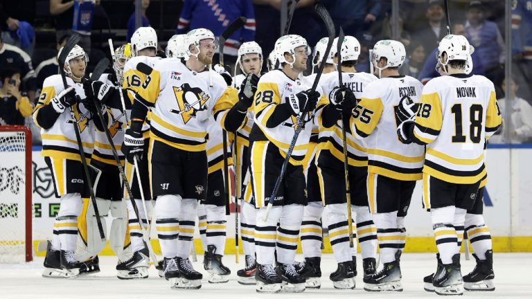 Pittsburgh Penguins defenceman Parker Wotherspoon (28) celebrates with teammates after defeating the New York Rangers in an NHL hockey game Tuesday, Oct. 7, 2025, in New York. (Adam Hunger/AP)