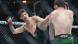 Australia's Quillan Salkilld lands a high kick during a UFC lightweight bout. (Frank Franklin II/AP)