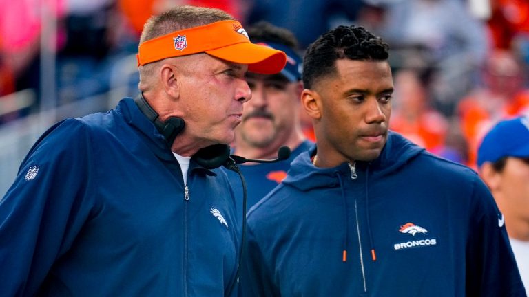 Denver Broncos head coach Sean Payton talks with Denver Broncos quarterback Russell Wilson (3) during a preseason NFL football game against the Los Angeles Rams Saturday, Aug. 26, 2023, in Denver. (AP Photo/Jack Dempsey)