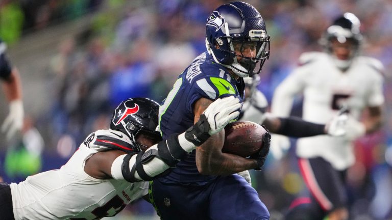 Seattle Seahawks wide receiver Jaxon Smith-Njigba (11) is tackled by Houston Texans defensive end Will Anderson Jr. (51) in the second half of an NFL football game Monday, Oct. 20, 2025, in Seattle. (Lindsey Wasson/AP)