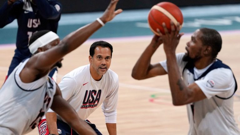 United State's Kevin Durant, right, shoots as Bam Adebayo, left, defends while assistant coach Erik Spoelstra watches during men's basketball practice at the 2024 Summer Olympics, Wednesday, July 24, 2024, in Villeneuve-d'Ascq, France. (Mark J. Terrill/AP)