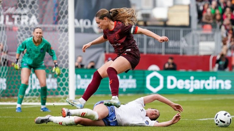 AFC Toronto defender Emma Regan (8) jumps over Montreal Roses FC Defender Lucy Cappadona (2) during second half Northern Super League soccer action in Toronto on Saturday, April 19, 2025. (Arlyn McAdorey/CP)