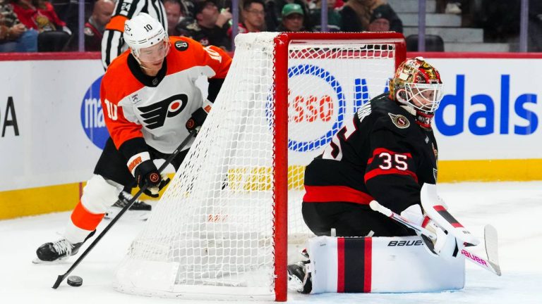 Philadelphia Flyers' Bobby Brink (10) attempts to wrap the puck around the net on Ottawa Senators goaltender Linus Ullmark (35) during first period NHL hockey action in Ottawa on Thursday, Oct. 23, 2025. (Sean Kilpatrick/CP)