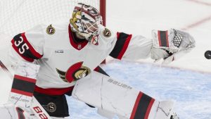 Ottawa Senators' goaltender Linus Ullmark tips a Toronto Maple Leafs shot with his glove during third period NHL playoff action in Toronto on Sunday, April 20, 2025. (THE CANADIAN PRESS/Nick Iwanyshyn)