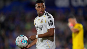 Real Madrid's Kylian Mbappe golds the ball during a La Liga match between Getafe and Real Madrid in Getafe, Spain, Sunday, Oct. 19, 2025. (Manu Fernandez/AP)