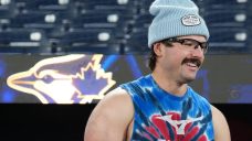 Blue Jays’ Davis Schneider goes barefoot in the park before Game 6