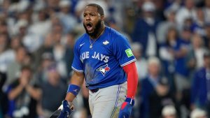 Toronto Blue Jays' Vladimir Guerrero Jr. celebrates after scoring on a base hit by Bo Bichette during the seventh inning in Game 3 of baseball's World Series against the Los Angeles Dodgers, Monday, Oct. 27, 2025, in Los Angeles. (Ashley Landis/AP)