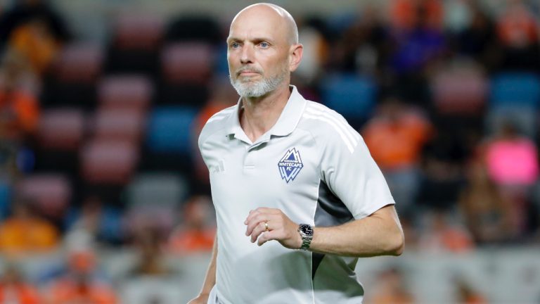 Vancouver Whitecaps head coach Jesper Sorensen comes onto the pitch during the second half of an MLS soccer match against the Houston Dynamo, Wednesday, July 16, 2025, in Houston. (Michael Wyke/AP)