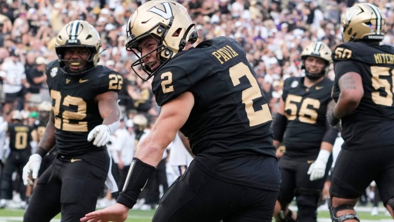 Vanderbilt quarterback Diego Pavia (2) celebrates his touchdown during the second half of an NCAA college football game against LSU, Saturday, Oct. 18, 2025, in Nashville, Tenn. (AP Photo/George Walker IV)