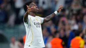 Real Madrid's Vinicius Junior celebrates after scoring the opening goal during the Spanish La Liga soccer match between Real Madrid and Villarreal at the Santiago Bernabeu stadium in Madrid, Spain, Saturday, Oct. 4, 2025. (AP/Manu Fernandez)