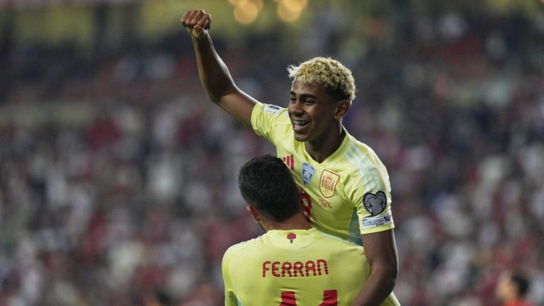 Spain's Ferran Torres, bottom, is congratulated by Lamine Yamal after scoring his side's 4th goal during a World Cup qualifying round Group E soccer match between Turkey and Spain at Konya Buyuksehir stadium, in Konya, Turkey, Sunday, Sept. 7, 2025. (Khalil Hamra/AP)