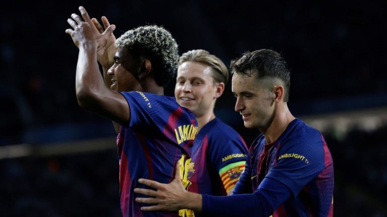Barcelona's Lamine Yamal, left, celebrates with teammates after scoring his side's third goal during the Champions League opening phase soccer match between Barcelona and Olympiacos in Barcelona, Spain, Tuesday, Oct. 21, 2025. (Joan Monfort/AP)
