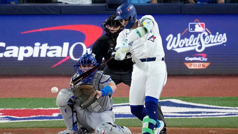 Toronto Blue Jays' Bo Bichette connects for a base hit against the Los Angeles Dodgers during the first inning in Game 1 of baseball's World Series. (David J. Phillip/AP)