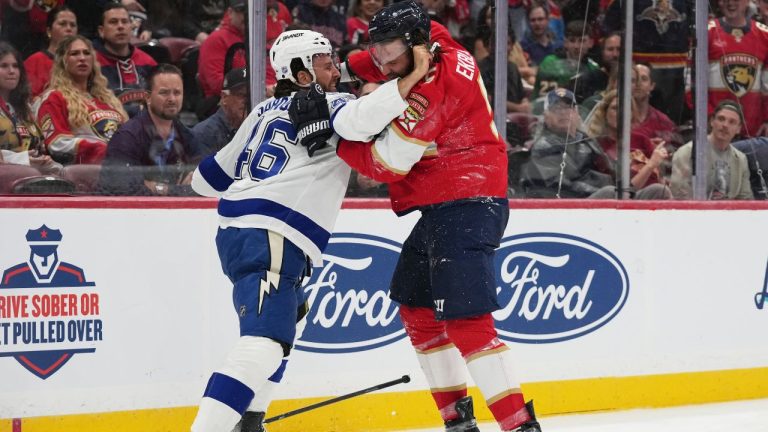 Tampa Bay Lightning right wing Scott Sabourin (left) and Florida Panthers defenceman Aaron Ekblad (right) trade blows during the first period of an NHL hockey preseason game, Saturday, Oct. 4, 2025, in Sunrise, Fla. (Lynne Sladky/AP)