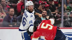 Tampa Bay Lightning right wing Scott Sabourin (46) and Florida Panthers defenceman Aaron Ekblad (5) trade blows during the first period of an NHL hockey preseason game, Saturday, Oct. 4, 2025, in Sunrise, Fla. (Lynne Sladky/AP)