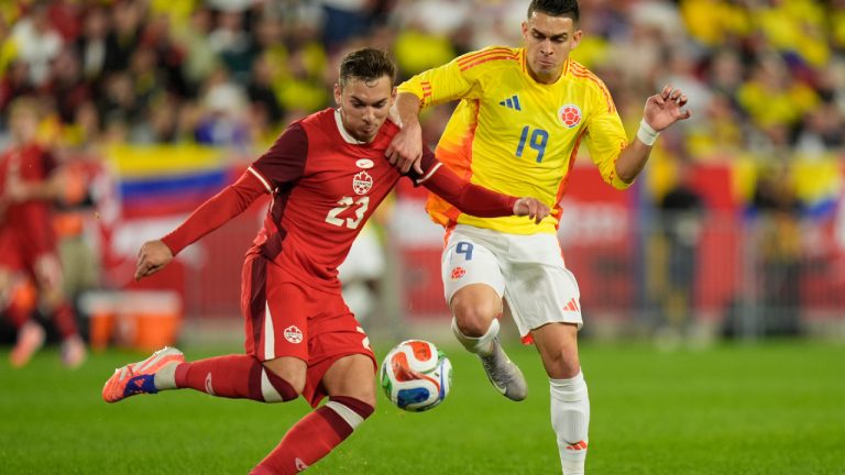 Canada's Niko Sigur, left, and Colombia's Rafael Borre Santos compete for the ball during the second half of a friendly international soccer match in Harrison, N.J., Tuesday, Oct. 14, 2025. (Seth Wenig/AP)