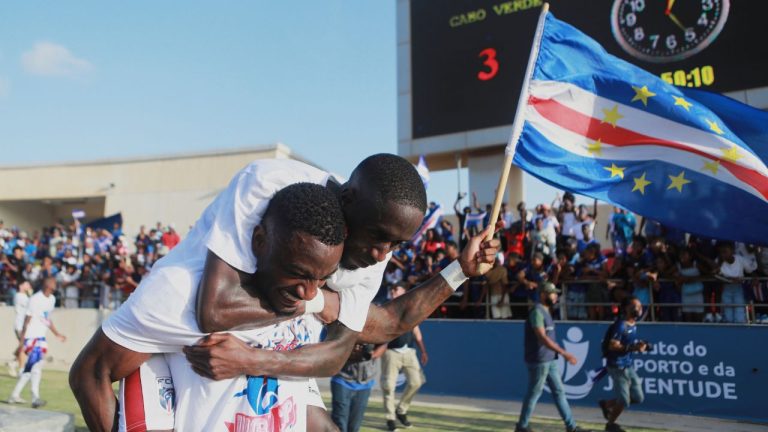 Cape Verde's Stopira, bottom, celebrates with his teammate after defeating Eswatini in a World Cup qualifying soccer match at Estádio Nacional in Praia, Cape Verde, Monday, Oct. 13, 2025, to clinch their qualification for the 2026 World Cup. (Cristiano Barbosa/AP)
