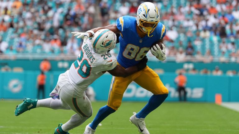 Los Angeles Chargers tight end Oronde Gadsden II, right, tries to get away from Miami Dolphins linebacker Jordyn Brooks during the second half of an NFL football game Sunday, Oct. 12, 2025, in Miami Gardens, Fla. (Rebecca Blackwell/AP Photo)