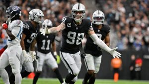 Las Vegas Raiders defensive end Maxx Crosby (98) celebrates after a sack against the Tennessee Titans during the first half of an NFL football game, Sunday, Oct. 12, 2025, in Las Vegas. (David Becker/AP Photo)
