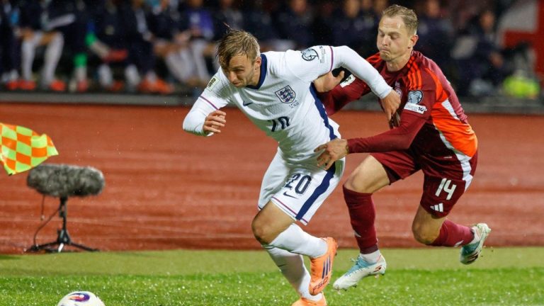 England's Jarrod Bowen tries to get away from Latvia's Andrejs Ciganiks during the 2026 World Cup group K qualifying soccer match between Latvia and England in Riga, Latvia, Tuesday, Oct. 14, 2025. (Mindaugas Kulbis/AP)