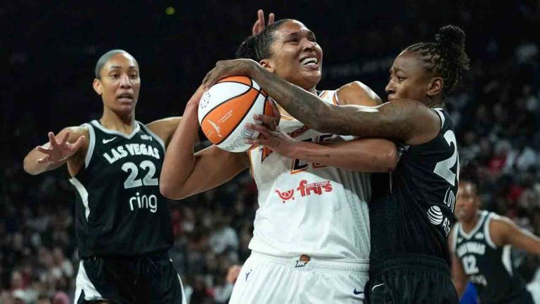 Las Vegas Aces guard Jewell Loyd (24), right, fouls Phoenix Mercury forward Alyssa Thomas (25) during the first half in Game 2 of the WNBA basketball finals, Sunday, Oct. 5, 2025, in Las Vegas. (John Locher/AP)