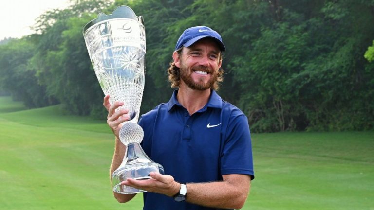 Tommy Fleetwood of England poses with the trophy after wining the DP World Tour Championship golf tournament in New Delhi, India, Sunday, Oct.19, 2025. (Dharam Diwakar/AP)