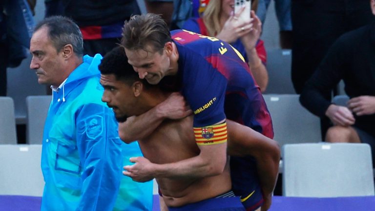 Barcelona's Frenkie de Jong hugs Ronald Araujo after a goa; during a La Liga soccer match between Barcelona and Girona in Barcelona, Spain, Saturday, Oct. 18, 2025. (Joan Monfort/AP)