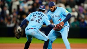 Toronto Blue Jays first base Vladimir Guerrero Jr. (27) and teammate Ernie Clement celebrate at the end of their 8-2 win over the Seattle Mariners in MLB American League Championship Series game 4 baseball action in Seattle, Thursday, Oct. 16, 2025. (Frank Gunn/CP)