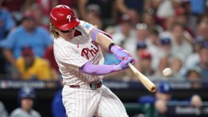 Philadelphia Phillies' Harrison Bader hits an RBI-sacrifice fly against Los Angeles Dodgers pitcher Shohei Ohtani during the second inning in Game 1 of baseball's National League Division Series, Saturday, Oct. 4, 2025, in Philadelphia. (Matt Slocum/AP)