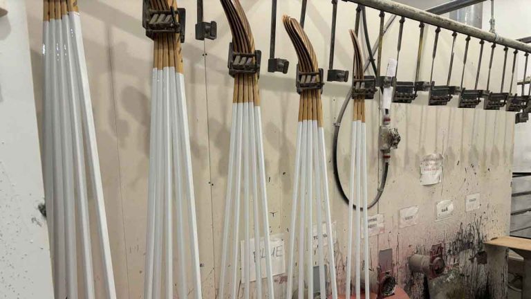Wooden hockey sticks are stacked as they move along the assembly line at the Roustan Hockey factory, which is the last major manufacturer of hockey sticks in Canada. (Kelvin Chan/AP)
