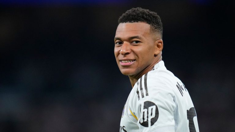 Real Madrid's Kylian Mbappe smiles during the Spanish La Liga soccer match between Real Madrid and Villarreal at the Santiago Bernabeu stadium in Madrid, Spain, Saturday, Oct. 4, 2025. (Manu Fernandez/AP)
