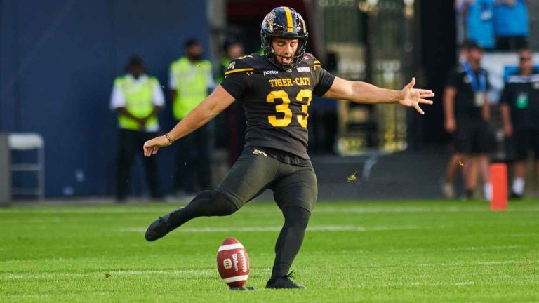 Hamilton Tiger-Cats kicker Marc Liegghio (33) kicks the ball against the Hamilton Tiger-Cats during first half CFL action. (Sammy Kogan/CP)