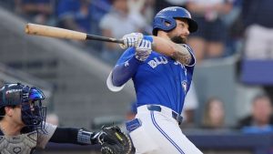 Toronto Blue Jays' Nathan Lukes (38) hits a two-run double against the New York Yankees during the seventh inning of game 1 in MLB American League Division Series baseball action in Toronto on Saturday, October 4, 2025. (Frank Gunn/CP)
